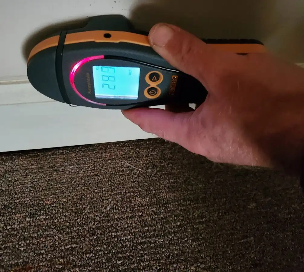 Moisture detection at baseboard during Storm Damage Restoration in Fontana